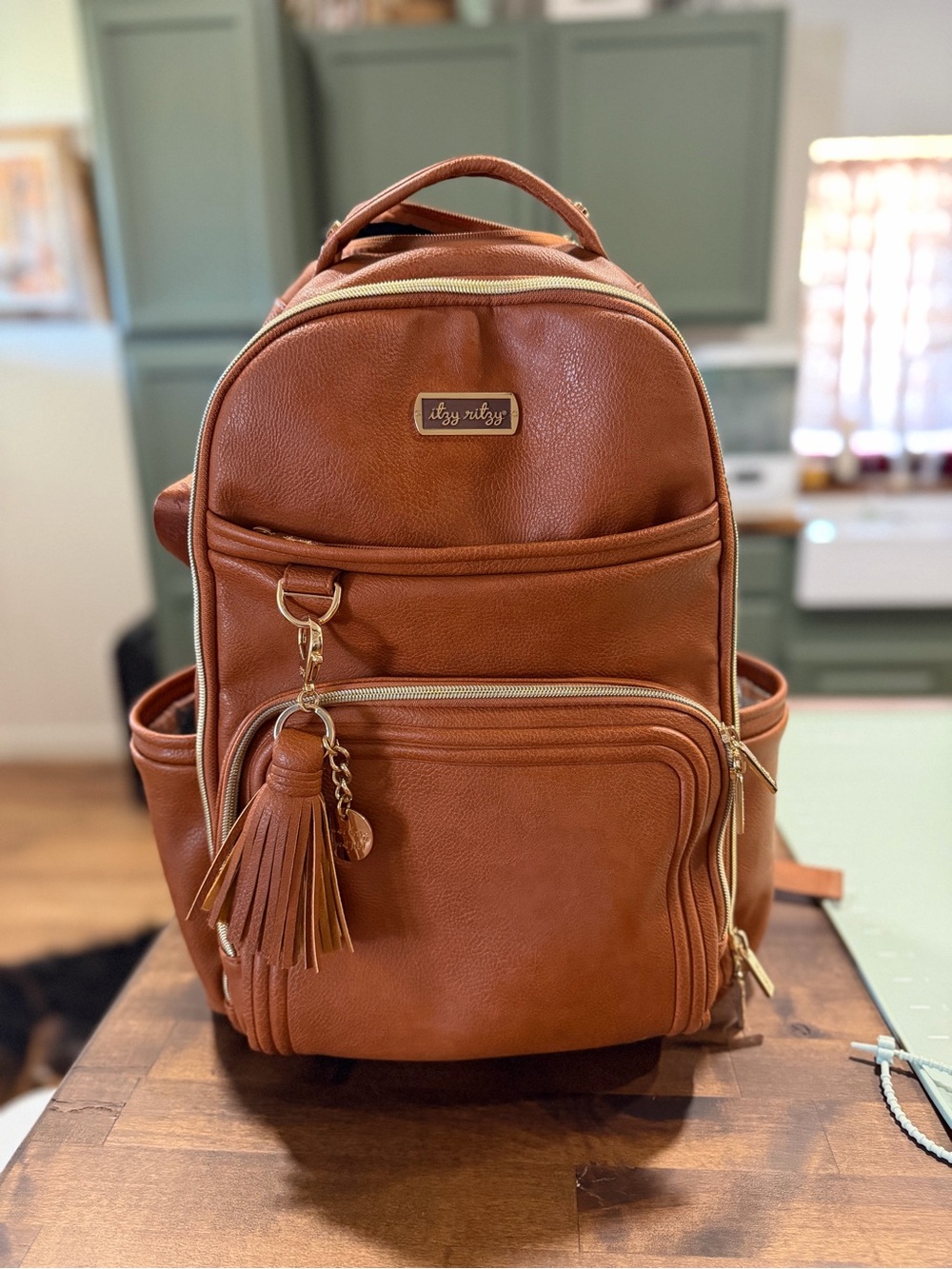 Itzy Ritzy Tan Faux Leather Backpack Diaper Bag with Tassel